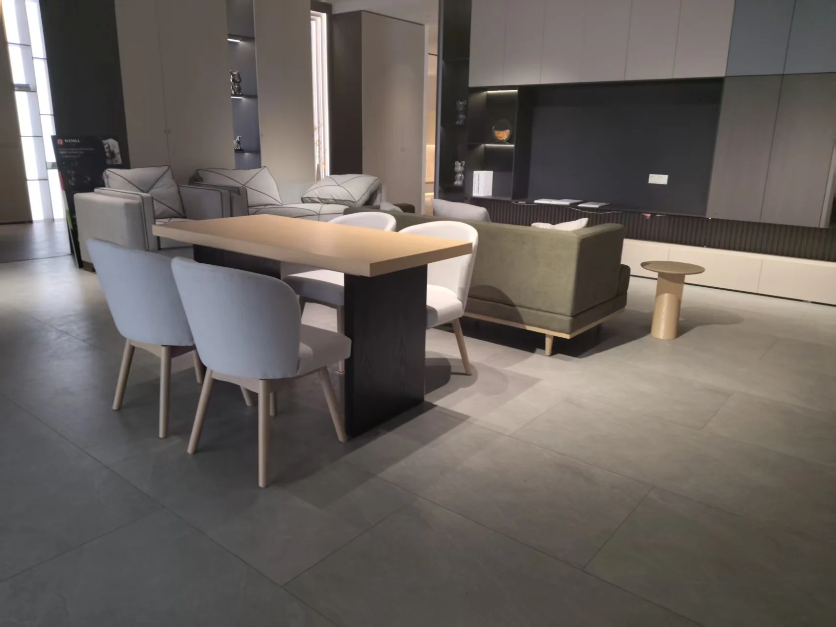 Client reviewing the living and dining areas of the physical guestroom mock-up